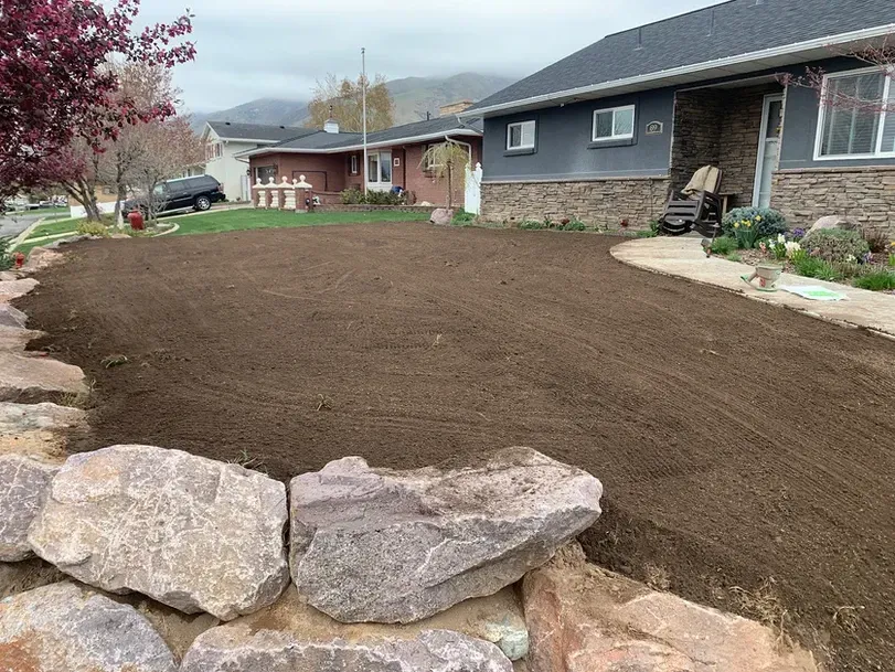 A house with a lot of dirt in front of it
