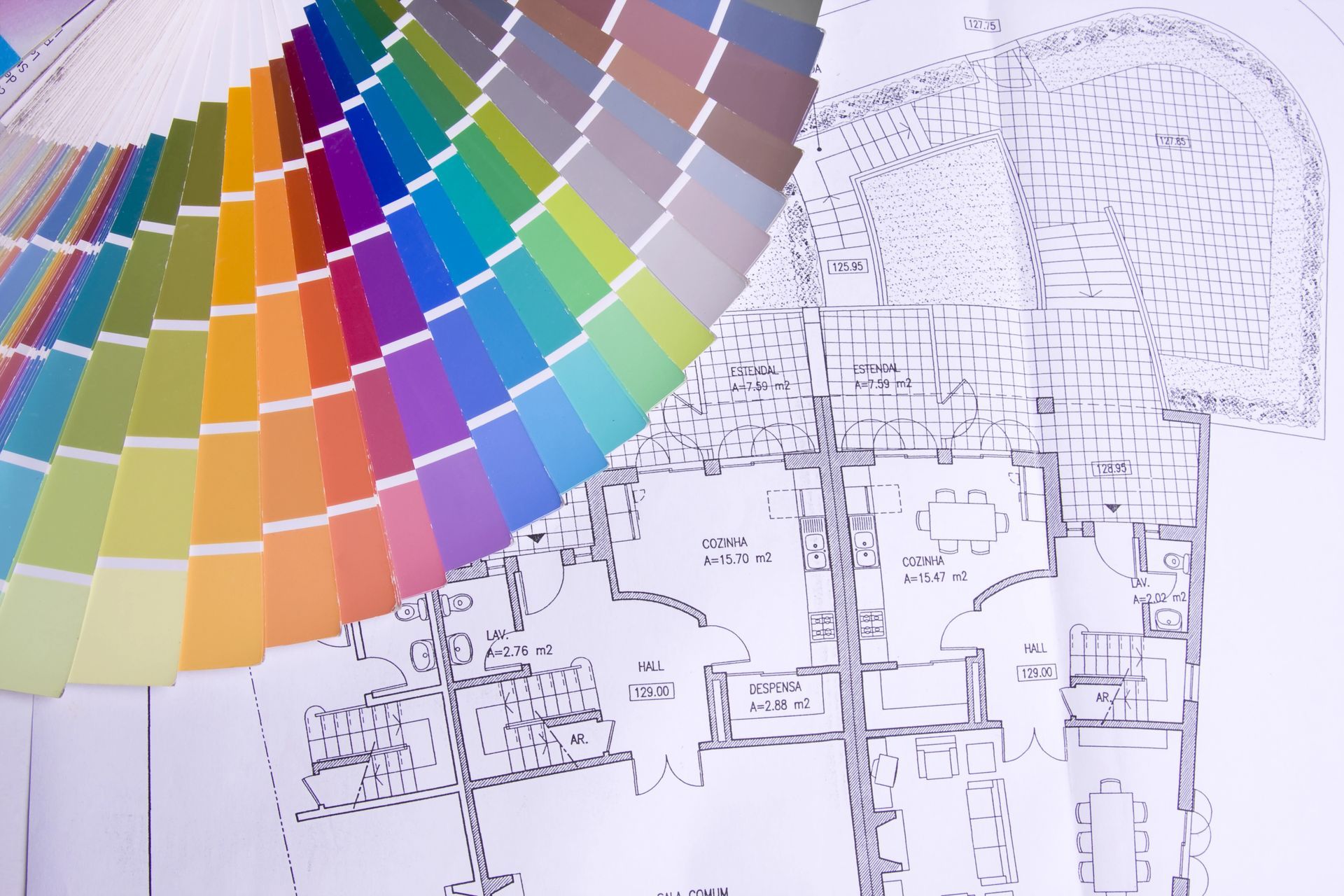 floor plans of a home with paint with swatches laid out on top for color planning