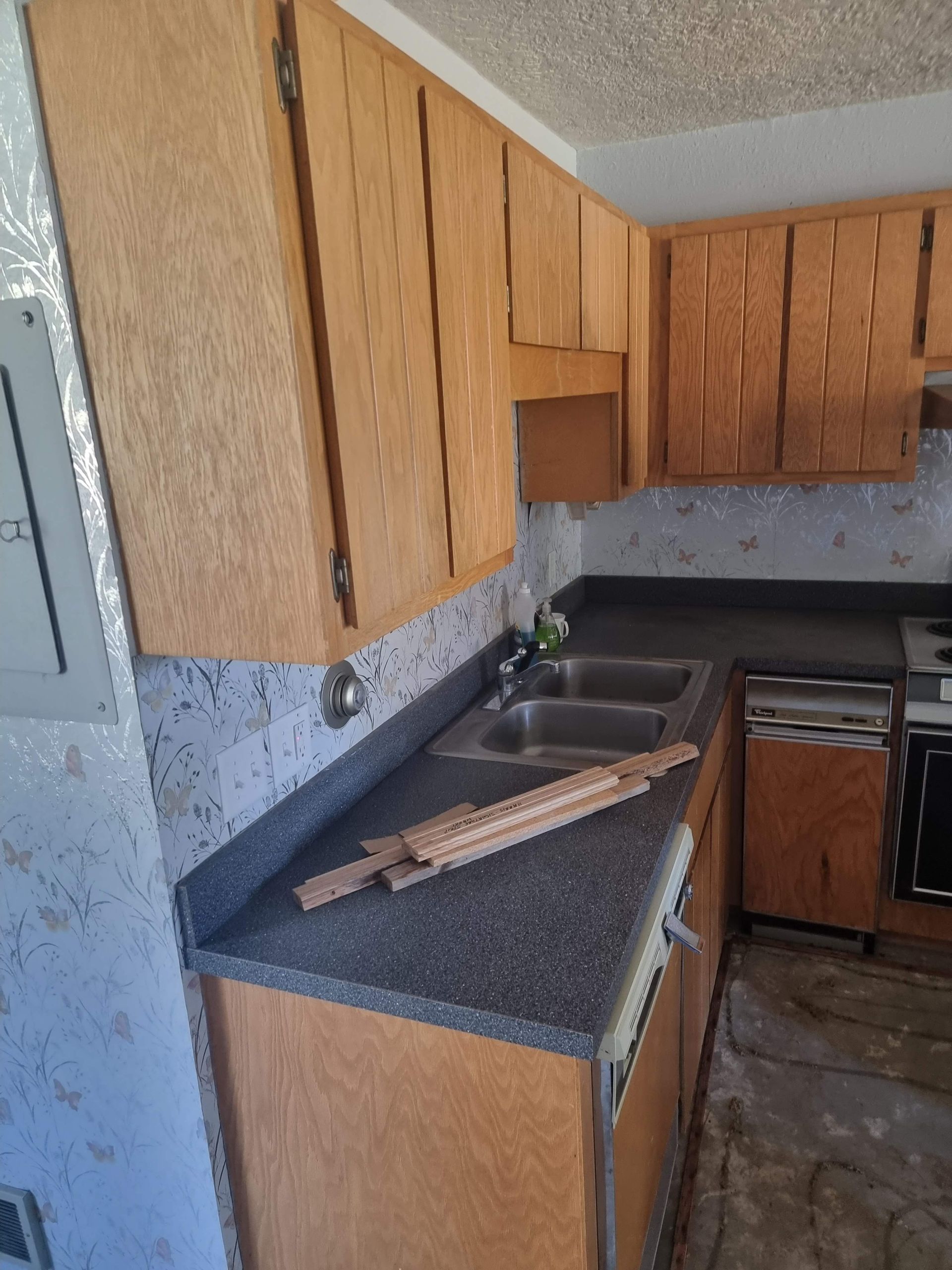 Outdated wood kitchen cabinets pre-renovation