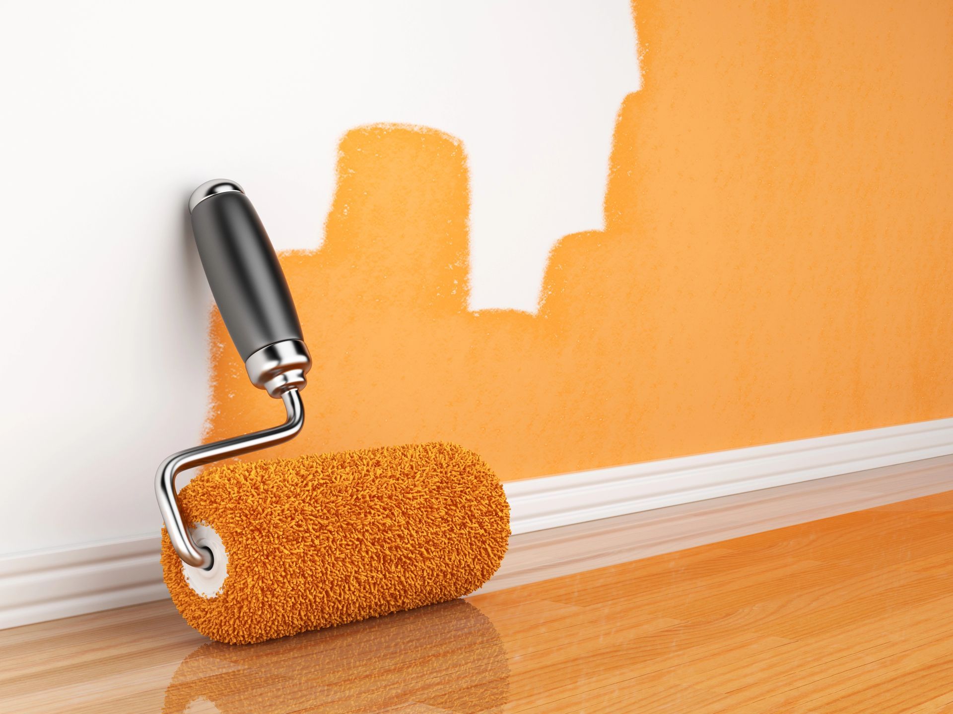 A paint roller covered in orange paint in front of a wall that is in the middle of being painted