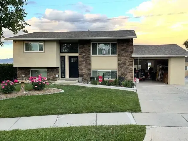 A large house with a lot of windows and a garage.