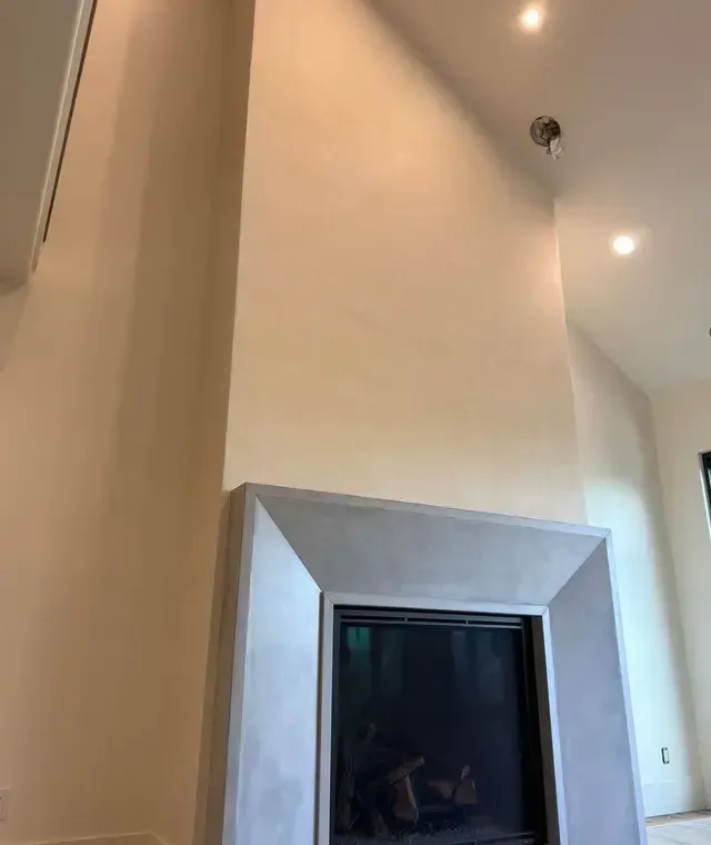 There is a fireplace in the middle of the room.