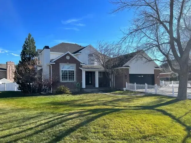 A large house with a large lawn in front of it
