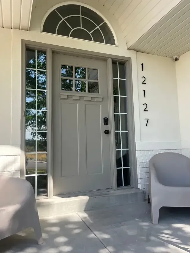 The front door of a house has the number 1237 on it
