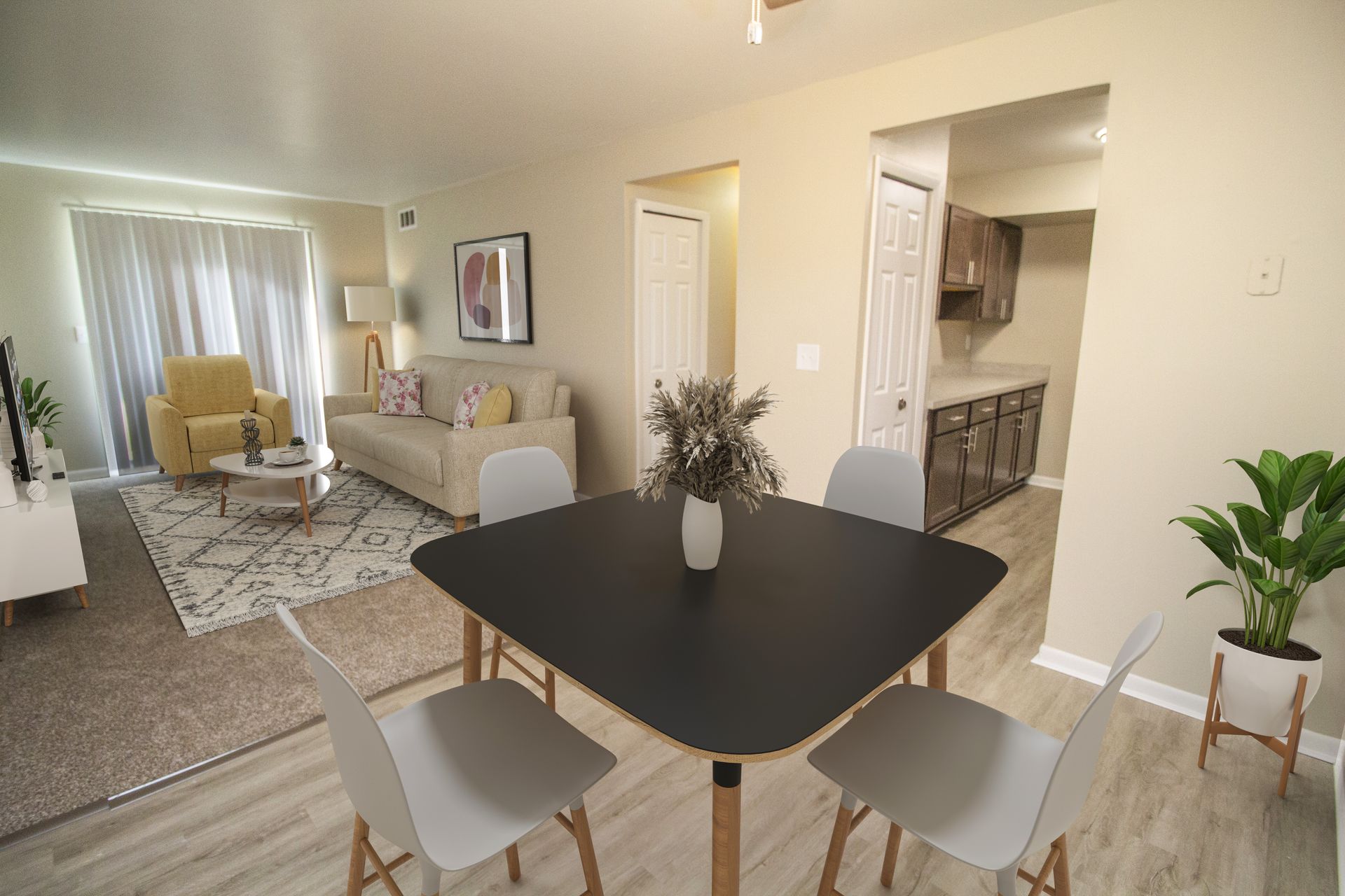 A living room with a table and chairs and a couch