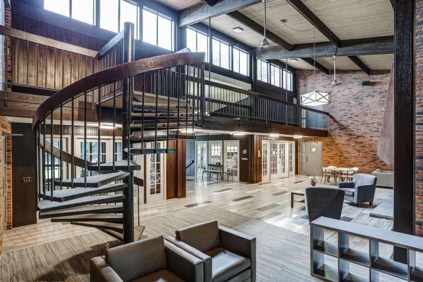 There is a spiral staircase in the middle of the room.