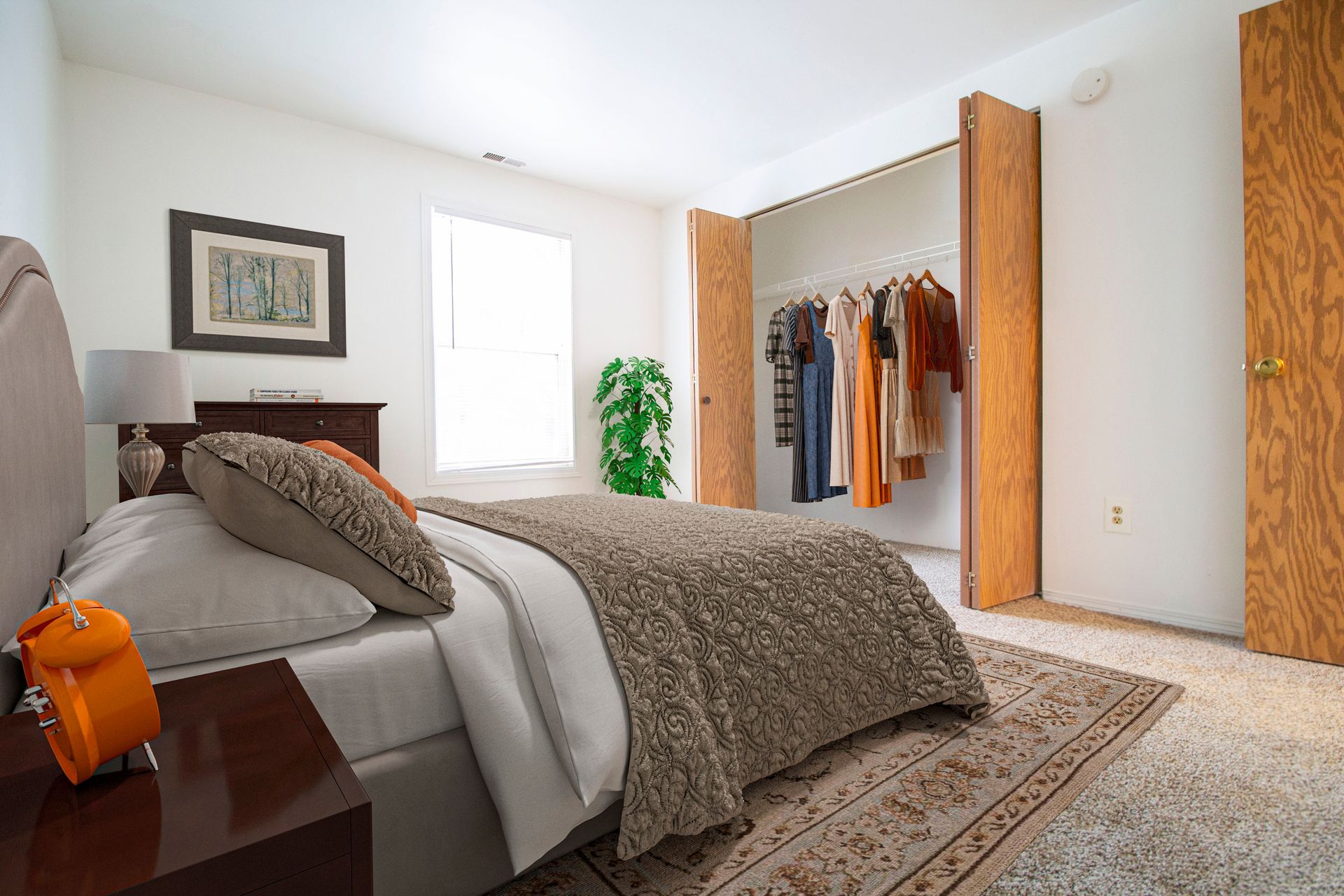 A bedroom with a bed , nightstand , and closet.