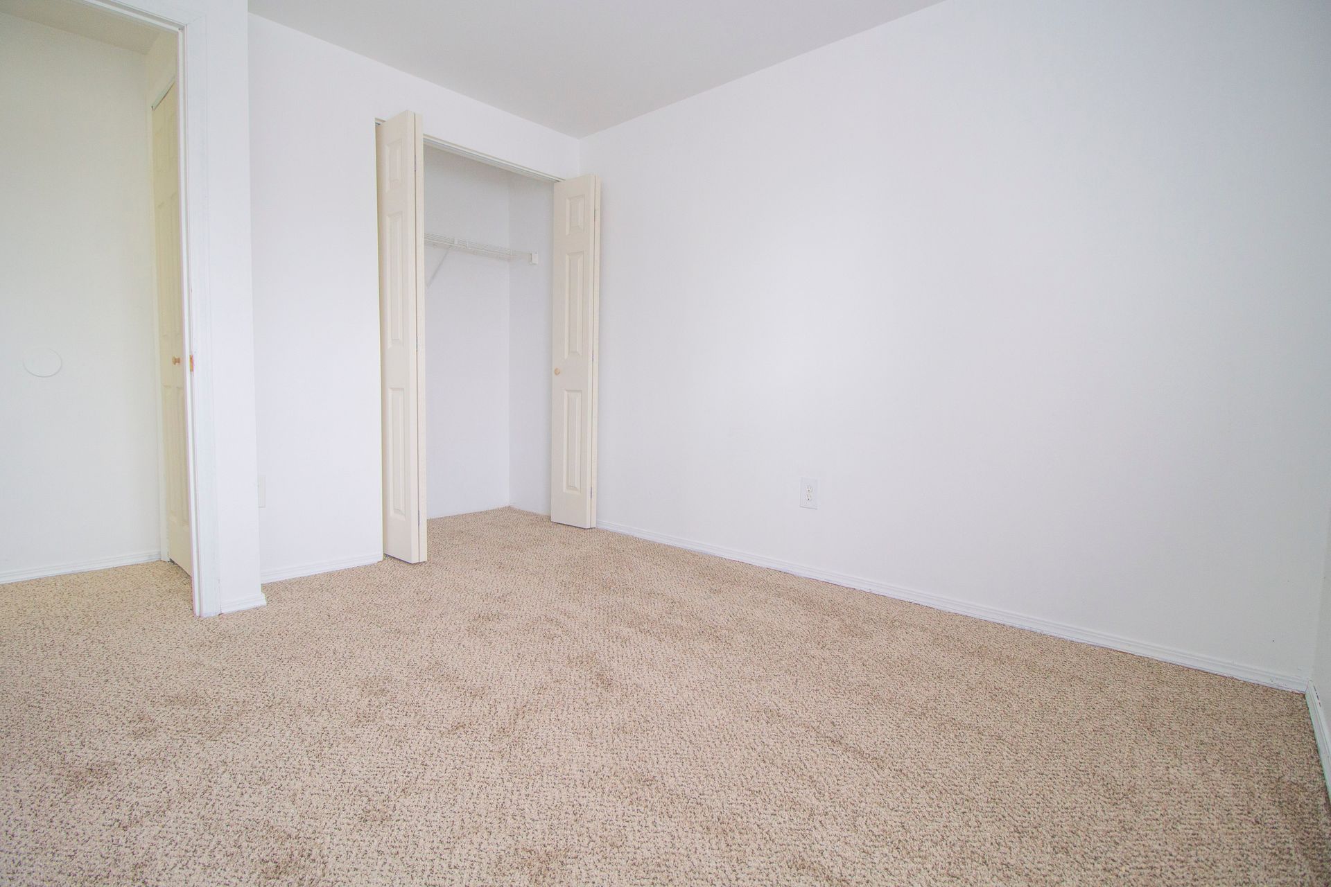 There is a closet in the corner of the room.