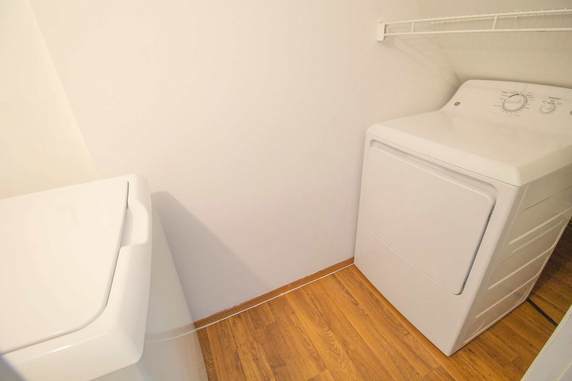 There is a washer and dryer in the laundry room.