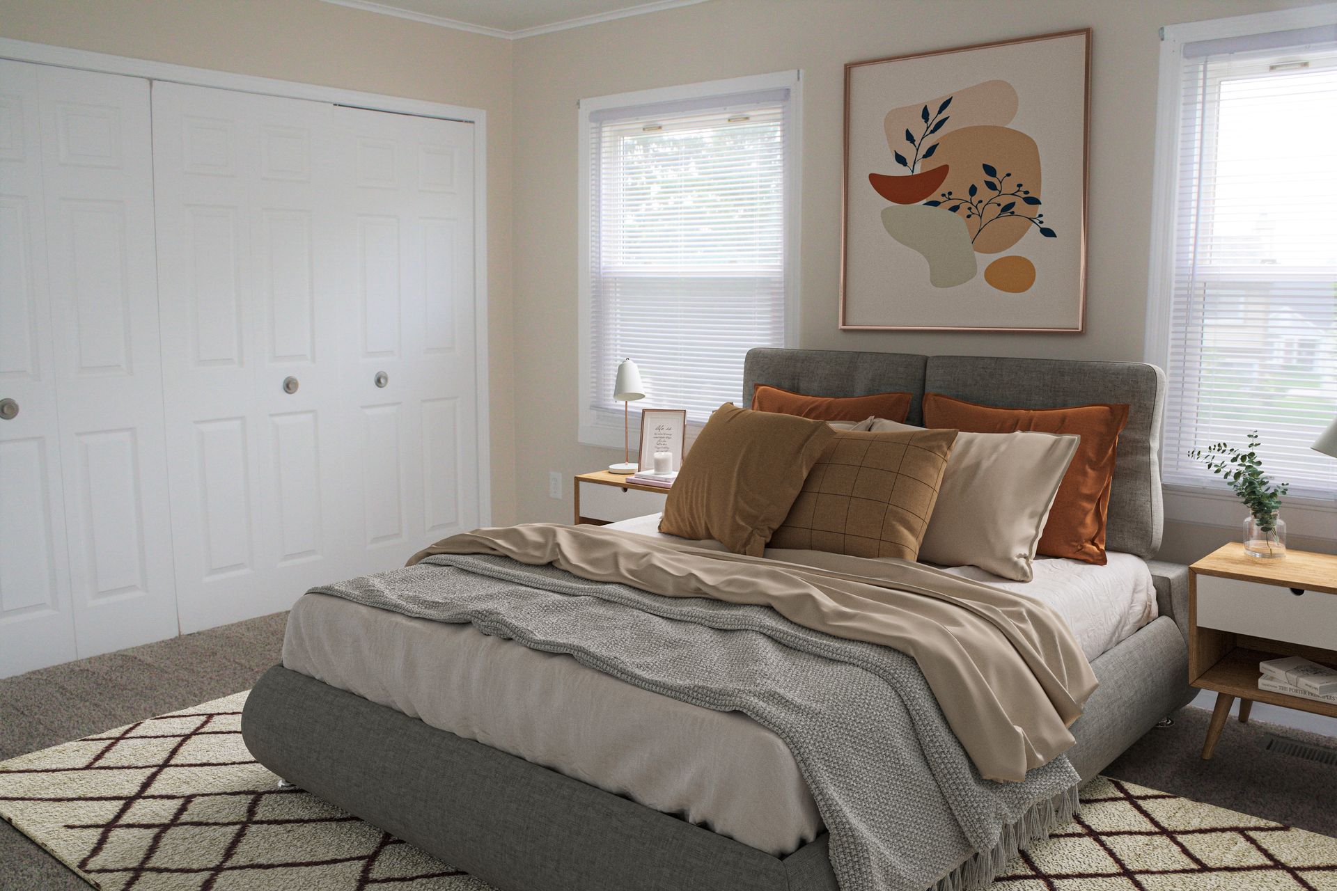 A bedroom with a bed and a painting on the wall.