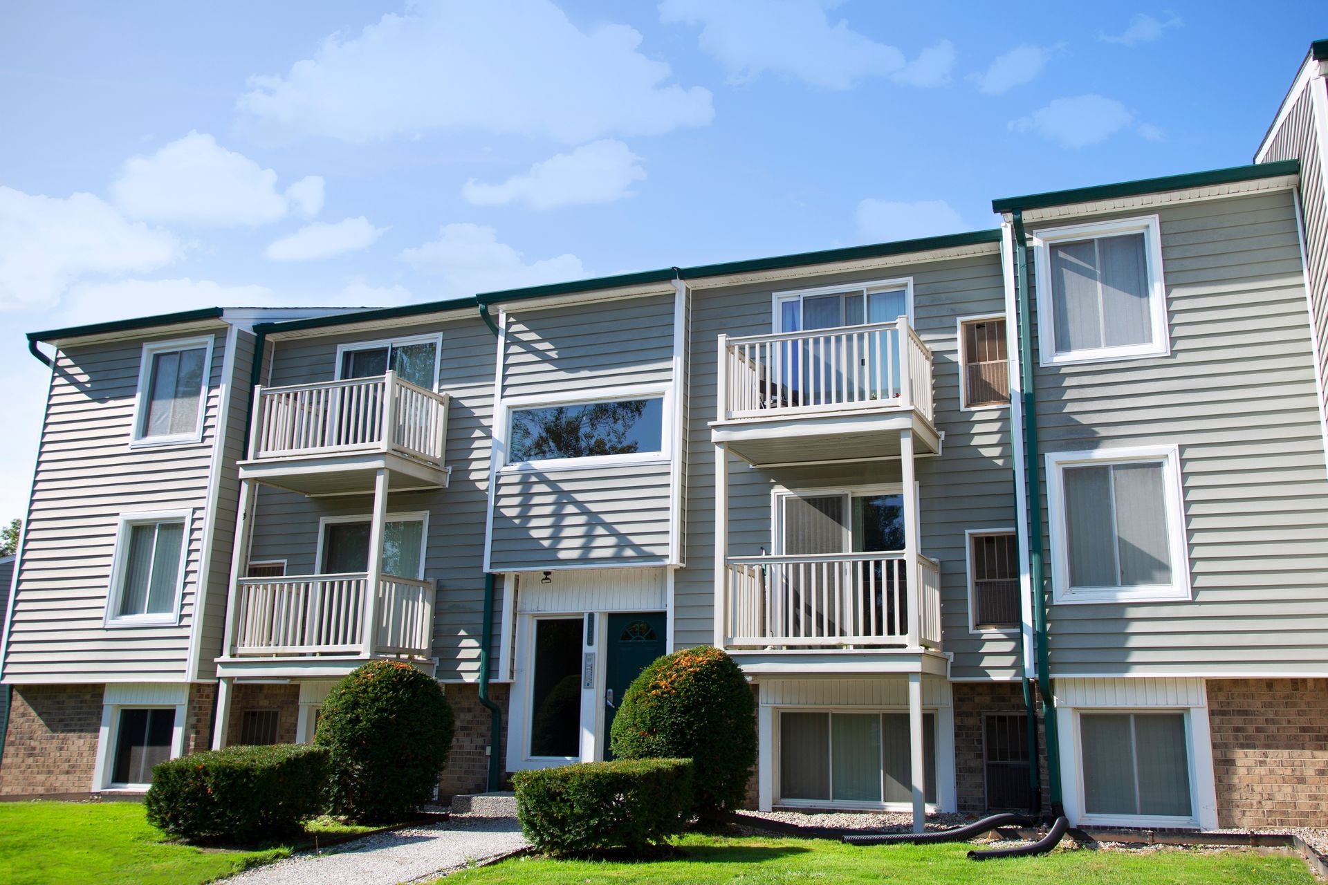 A large apartment building with a lot of windows and balconies
