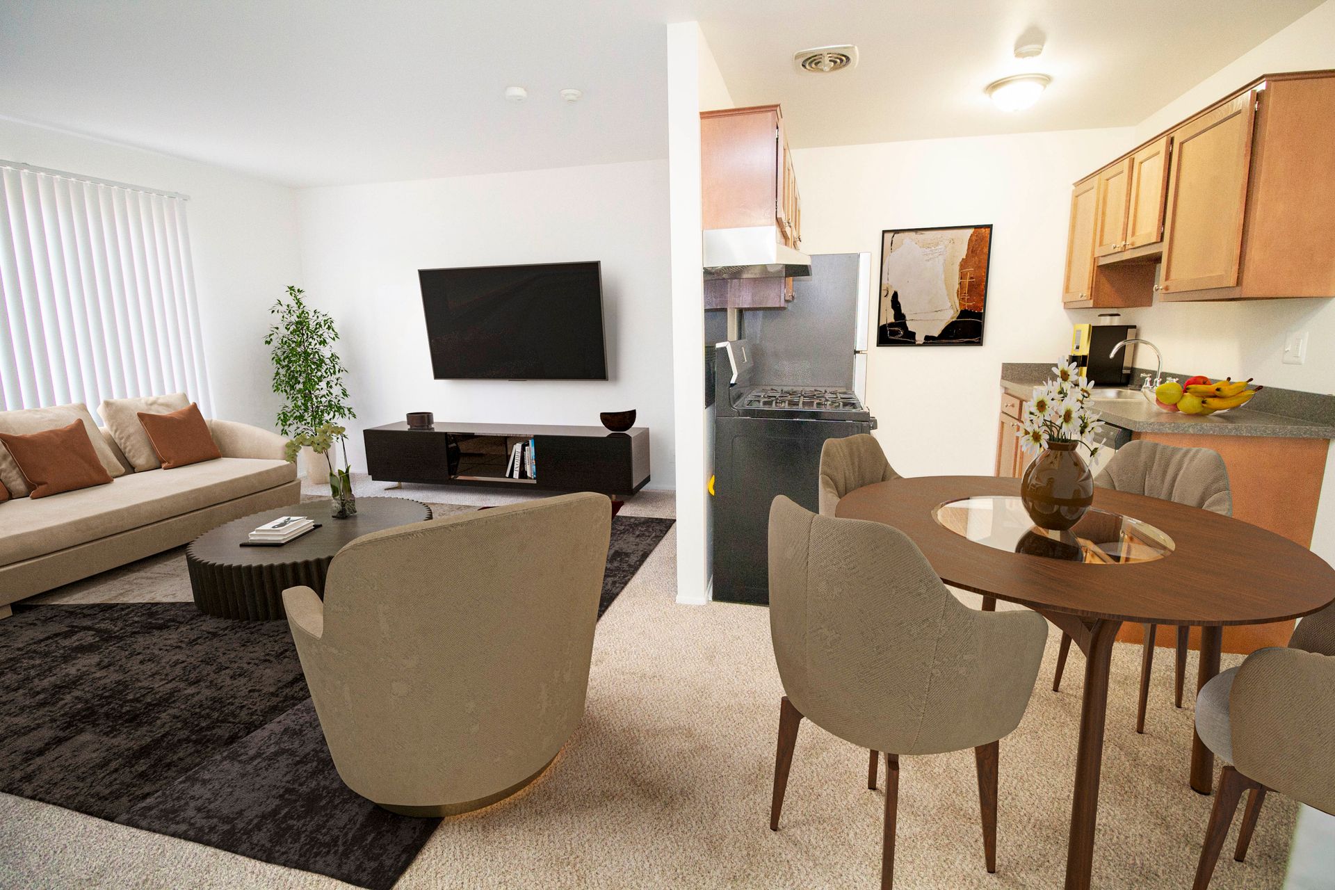 A living room with a couch , chairs , a table and a television.