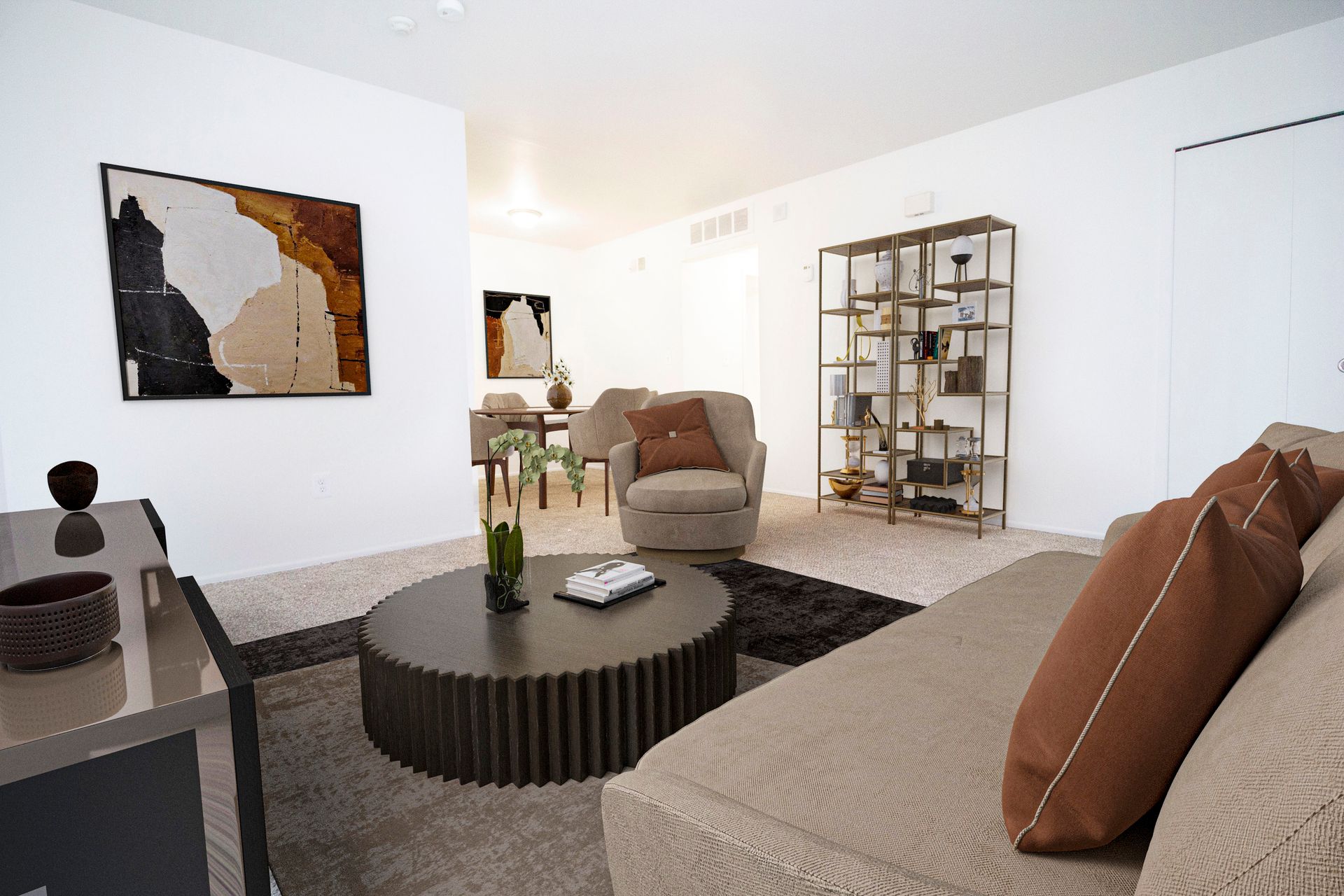 A living room with a couch , chair , coffee table and painting on the wall.