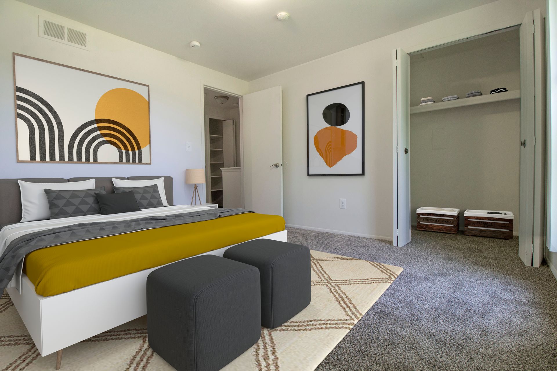 A bedroom with a bed , ottomans , a closet and a painting on the wall.