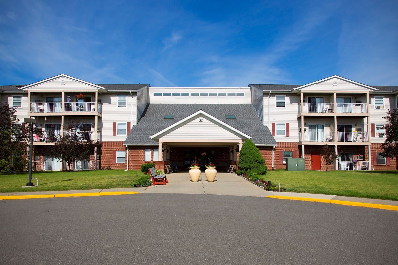 A large apartment building with a lot of windows and balconies