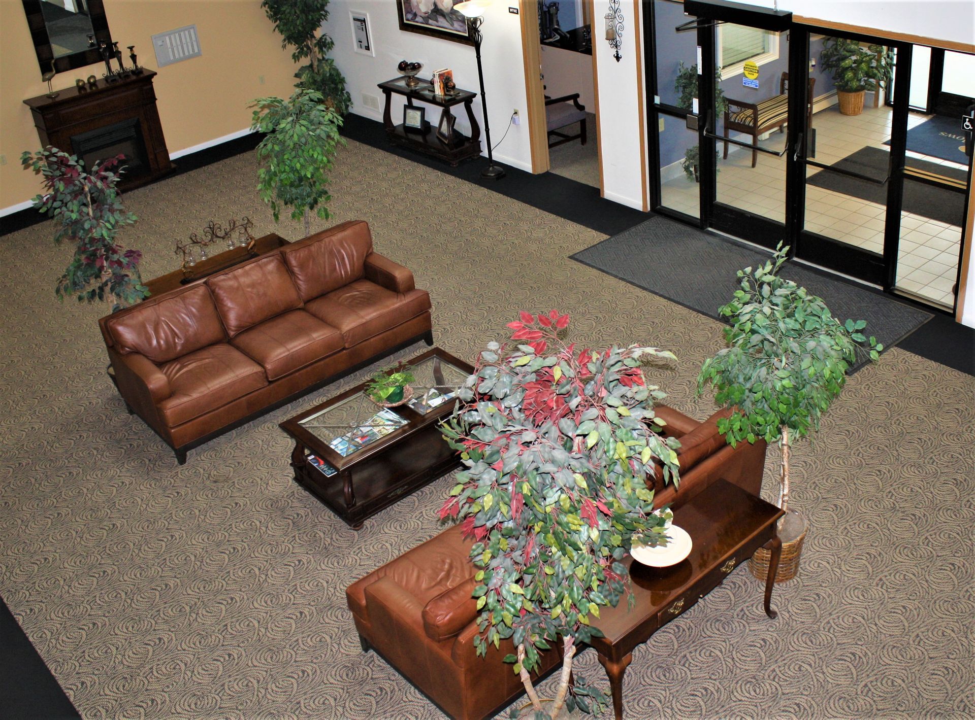 An aerial view of a living room with a couch and a coffee table