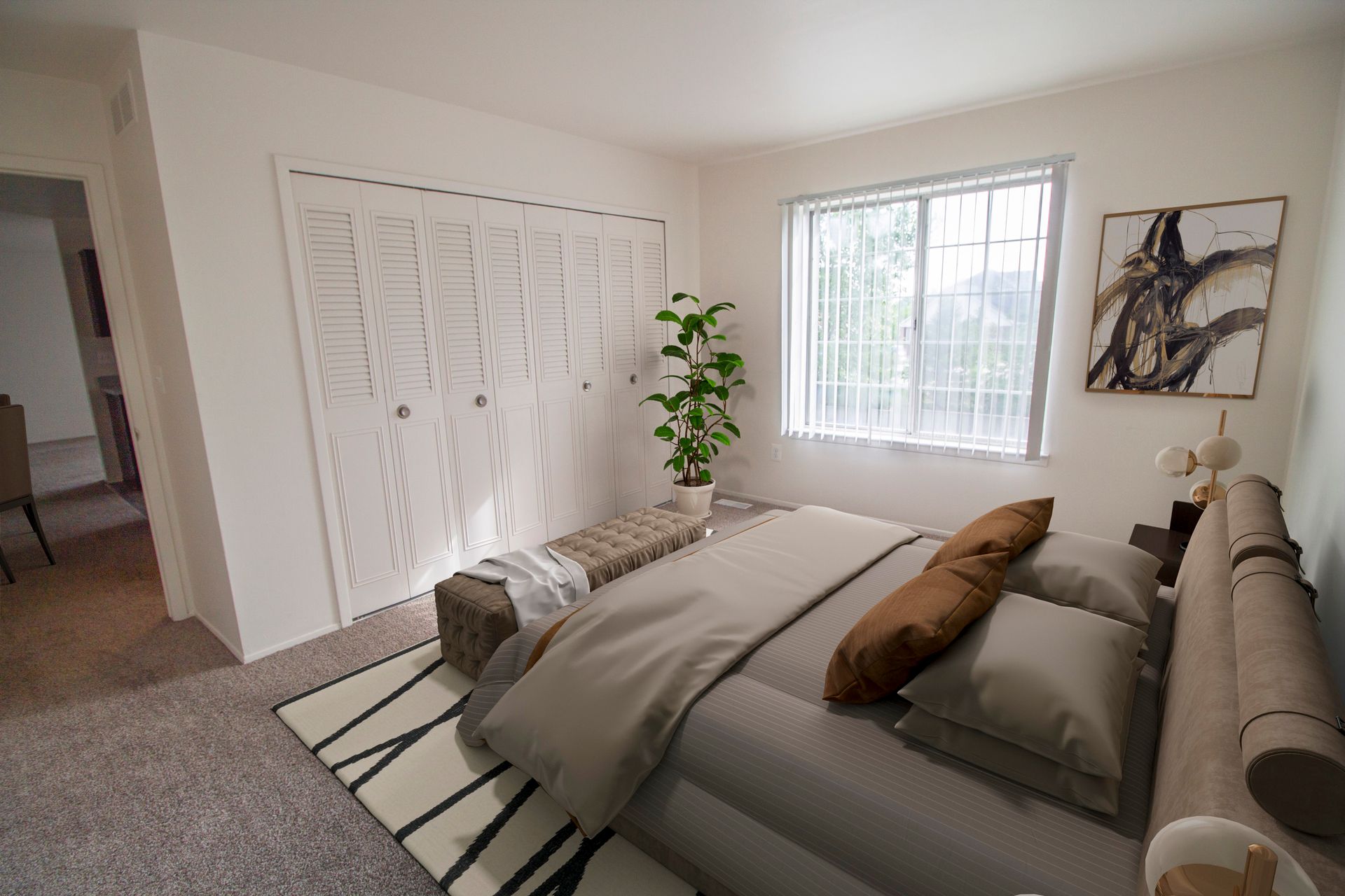 A bedroom with a large bed and a window.