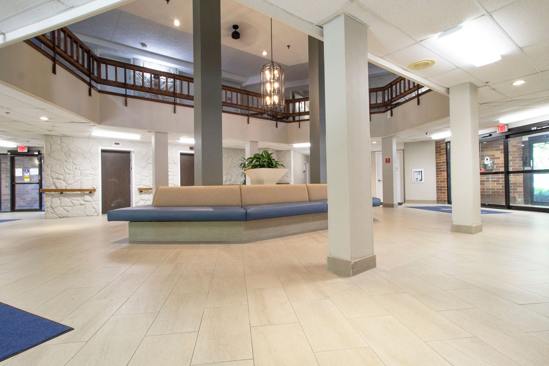 A large lobby with a couch in the middle of it