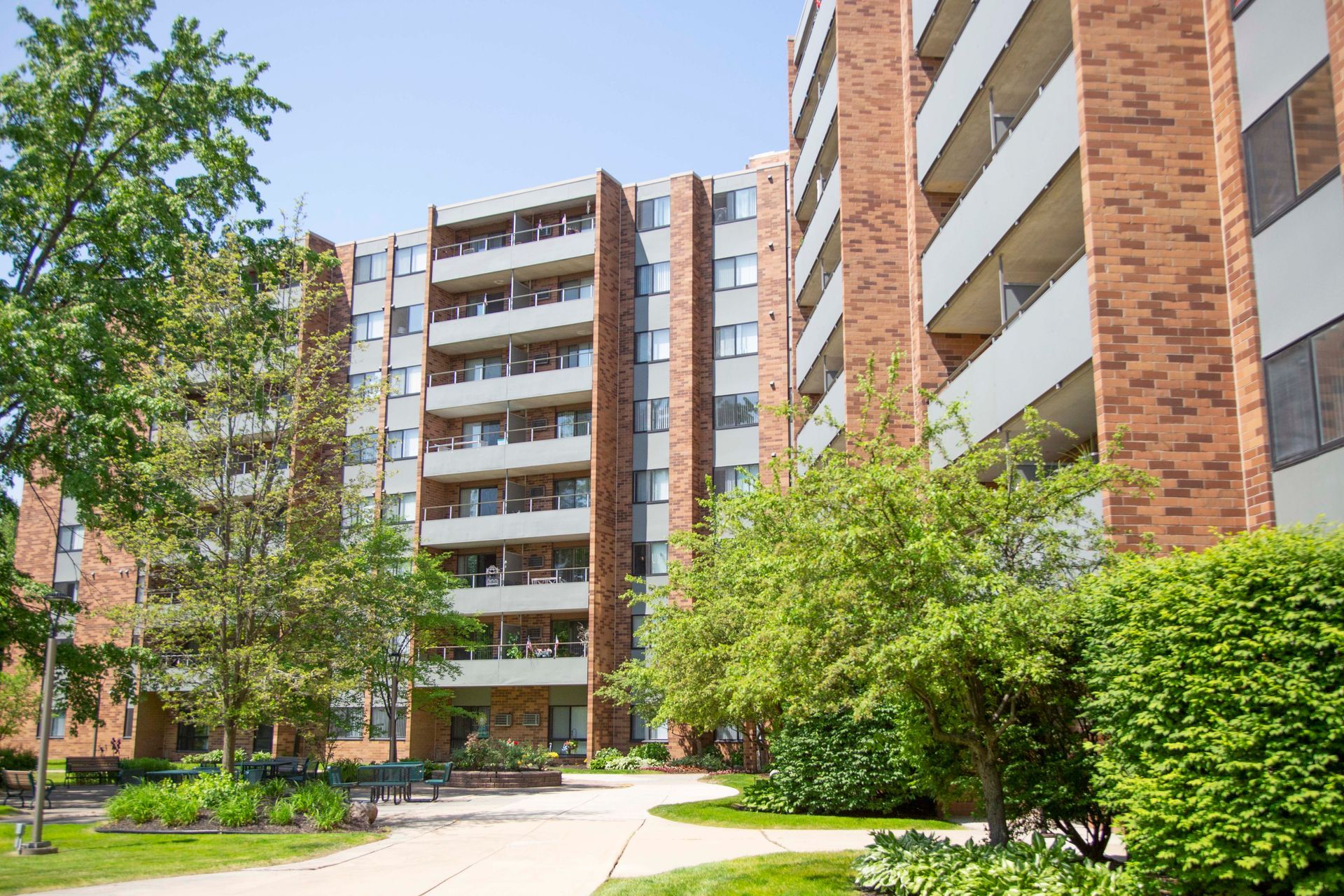 A large apartment building with a lot of windows and balconies