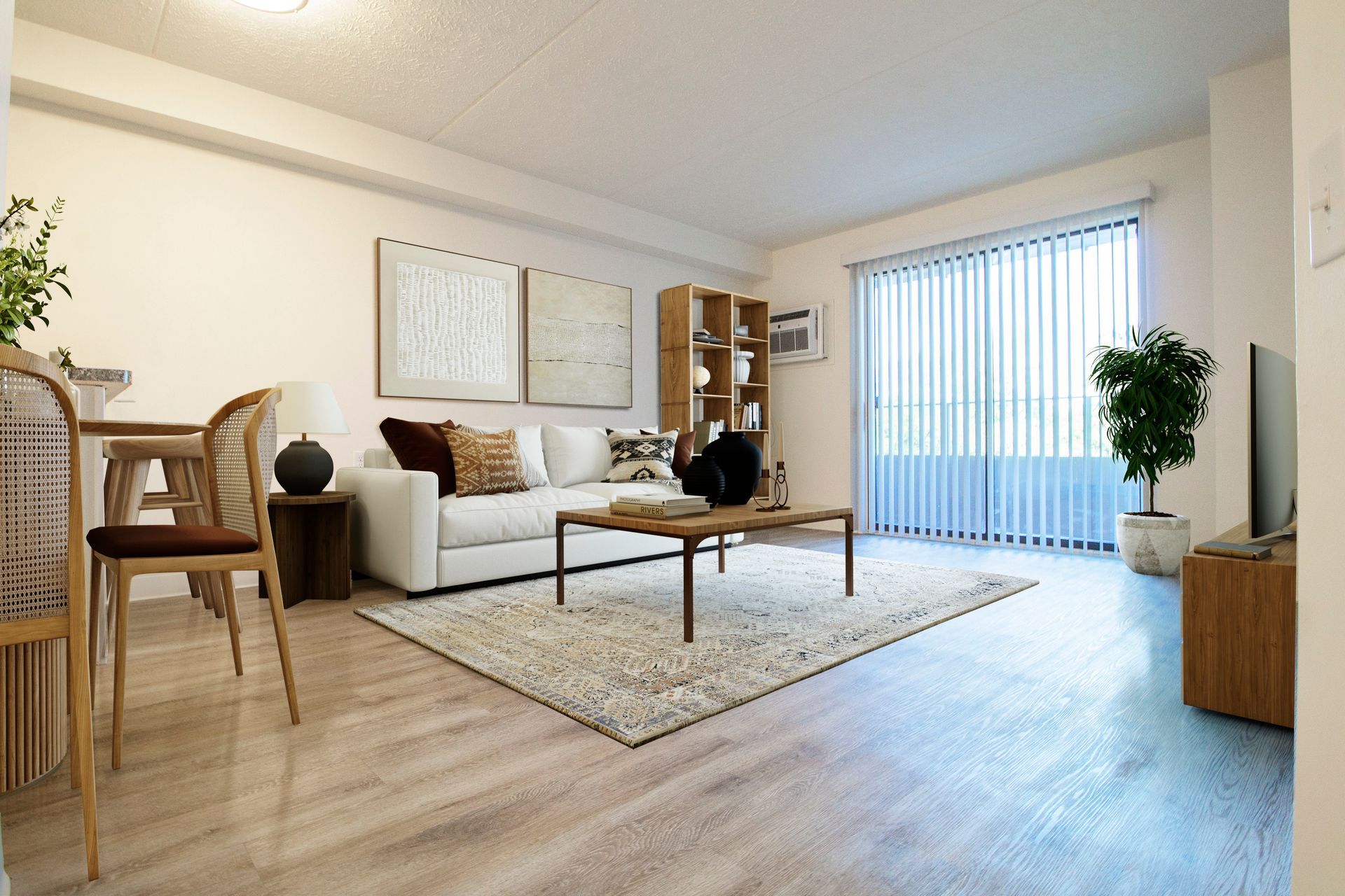 A living room with a couch , coffee table , chairs and sliding glass doors.