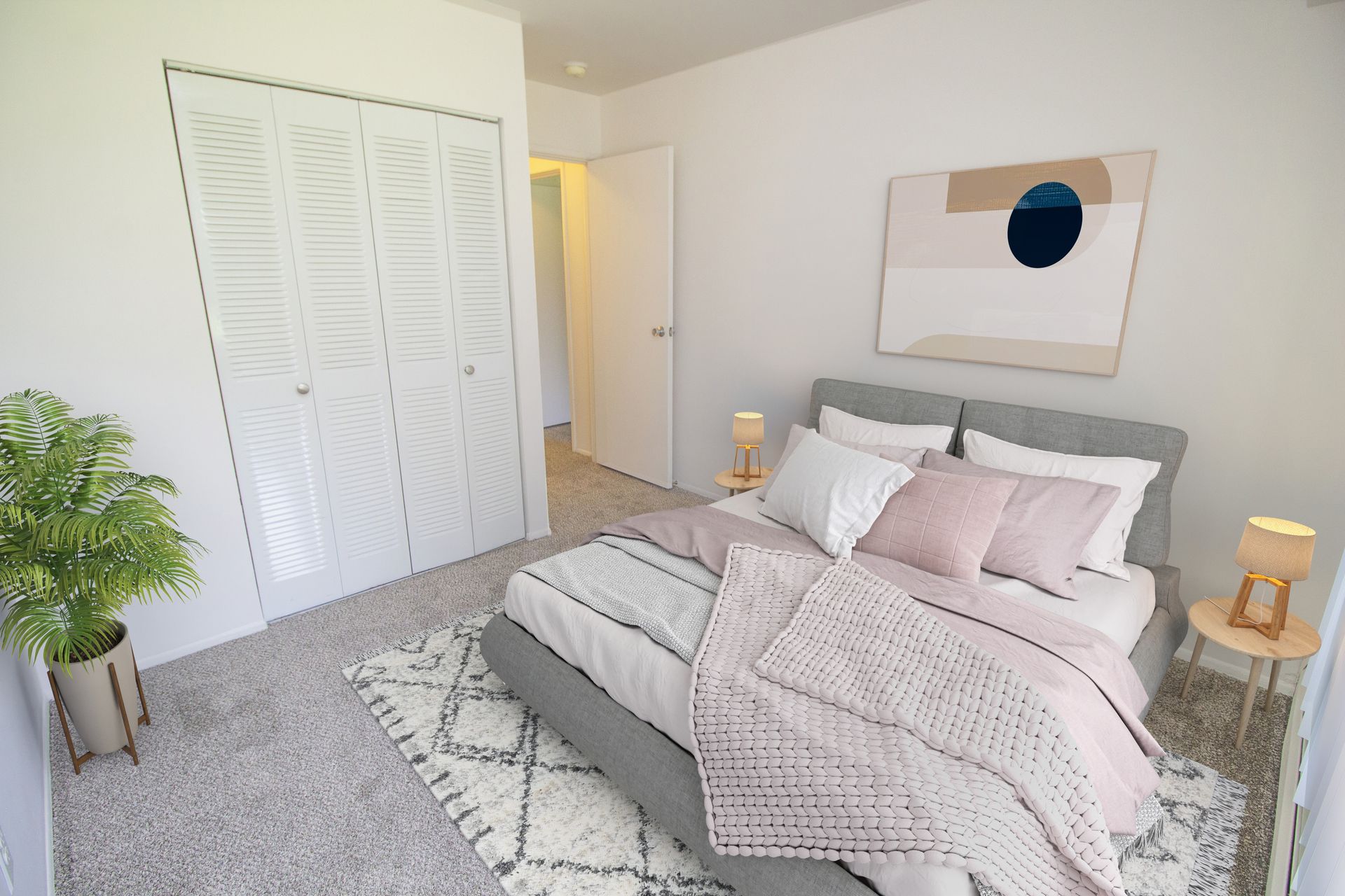 A bedroom with a large bed and a closet.