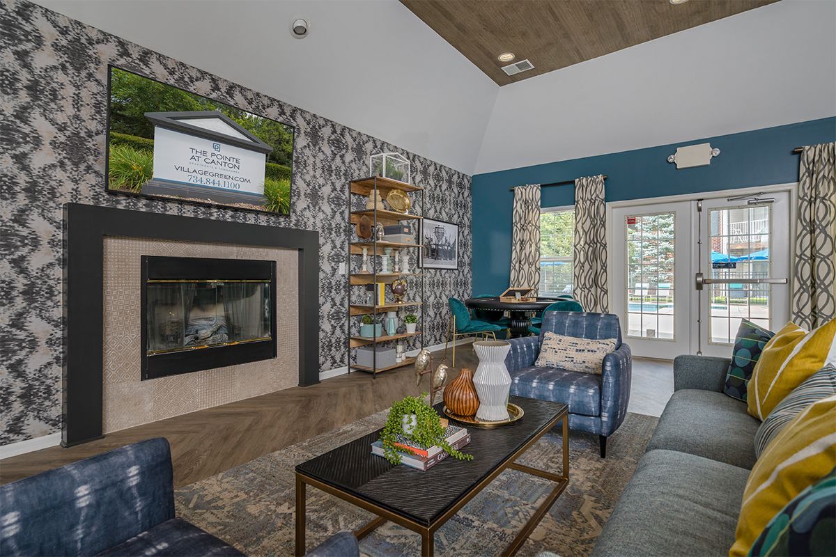 A living room filled with furniture and a fireplace.