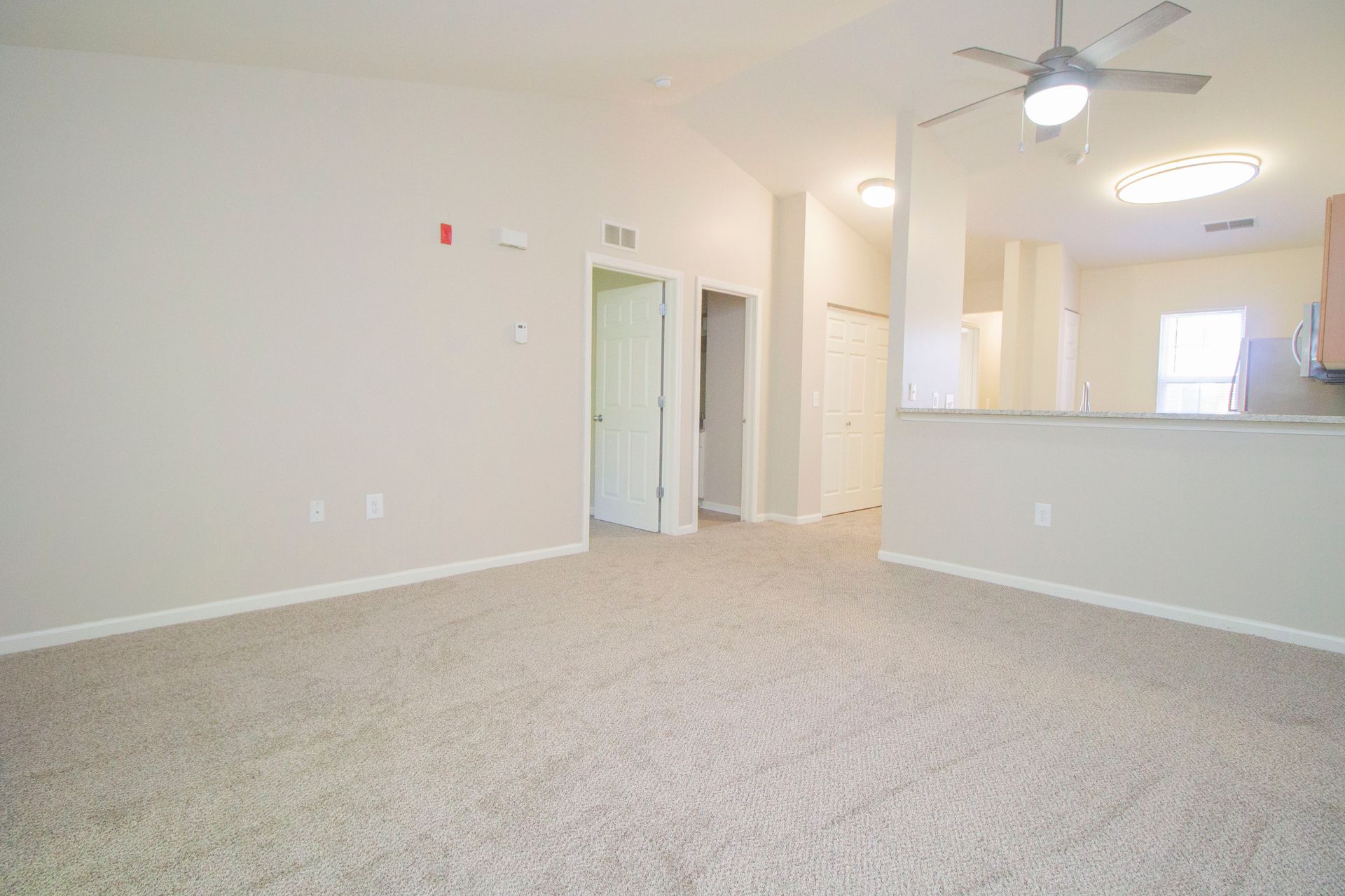 There is a ceiling fan in the living room.