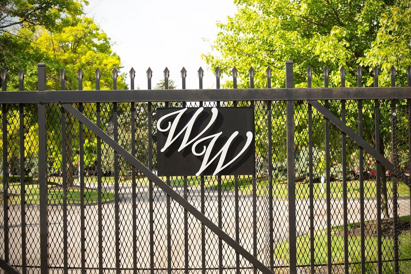 A fence with a sign that says