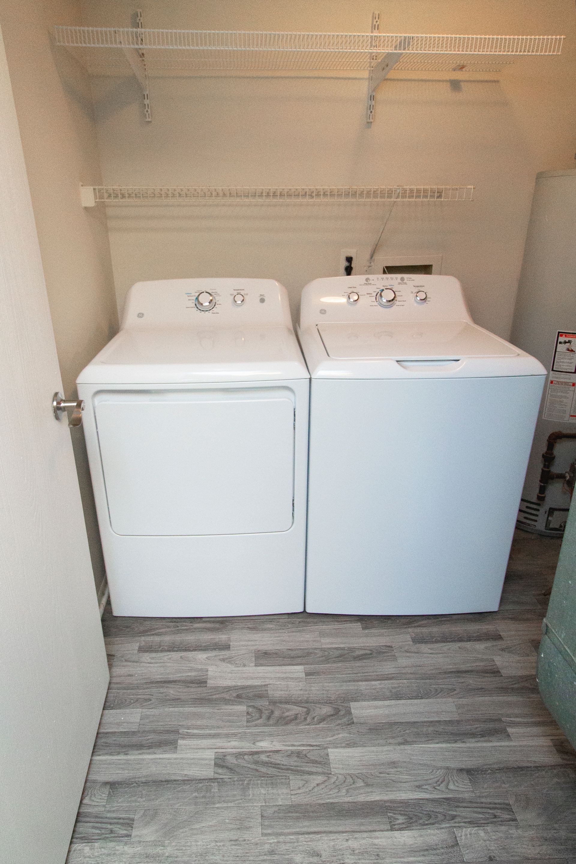 A laundry room with a washer and dryer in it.