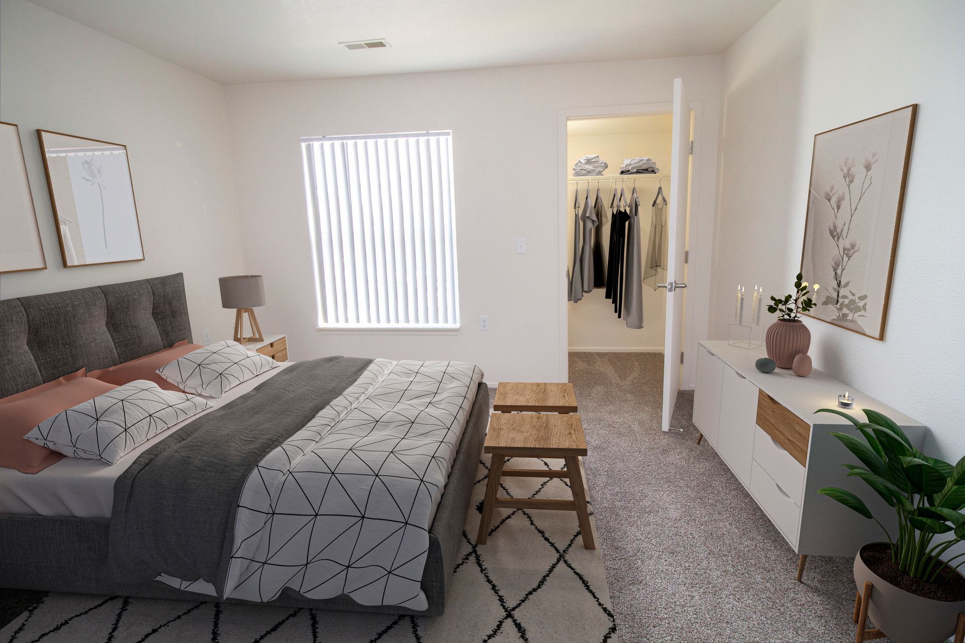 A bedroom with a large bed and a walk in closet.