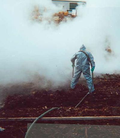 Worker Doing Hazmat Cleanup— Somerset, TX — Approved Oil Services LLC