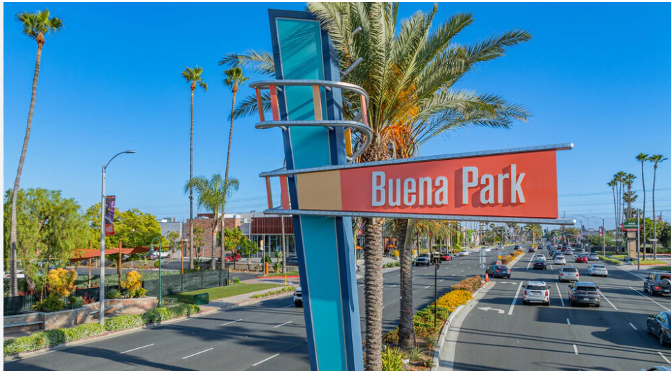 A sign for Private Investigator buena park in the middle of a street.