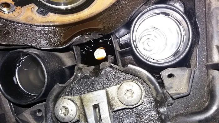 A close up of a piece of metal with a hole in it.