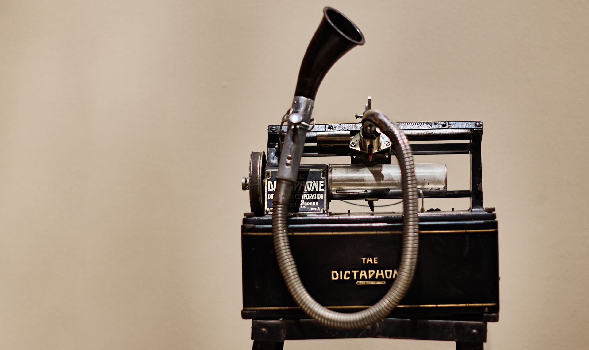 A conference room with a brick wall and wooden ceiling