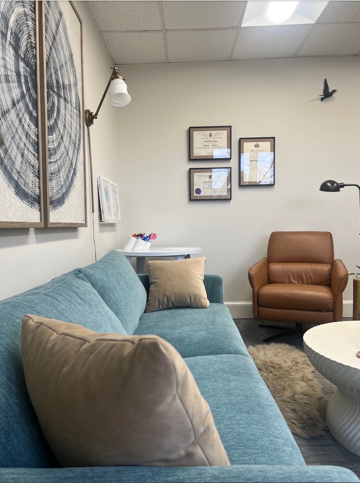 Dr. Sehon's clinical setting with a blue couch and a brown chair
