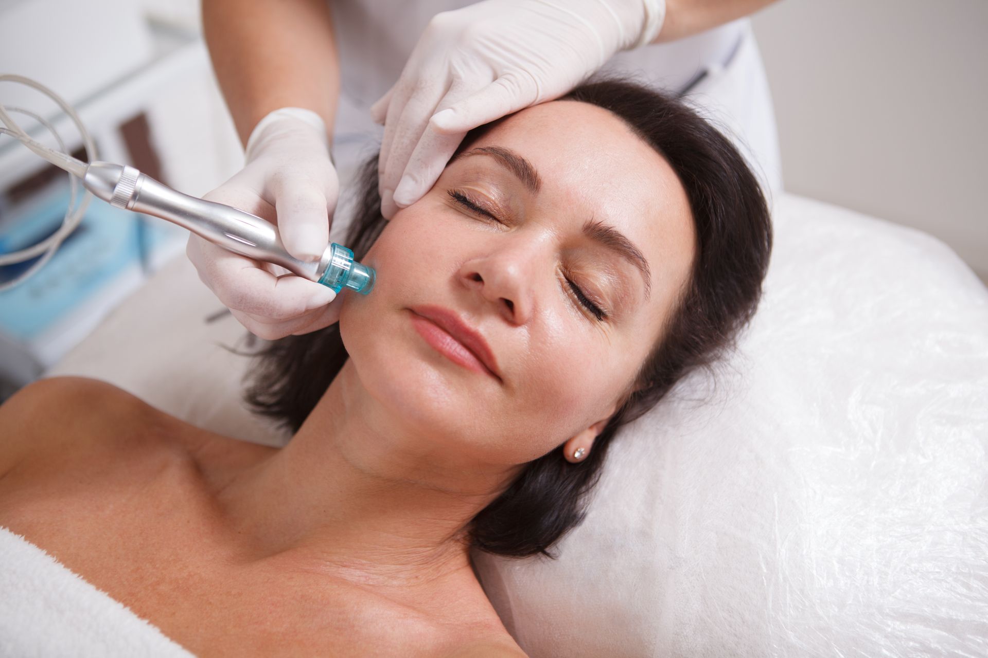 a woman is getting a facial treatment at a beauty salon .