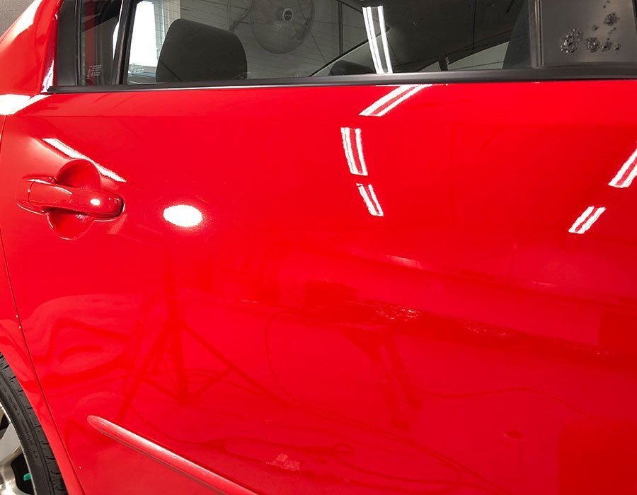shiny red car after paint correction