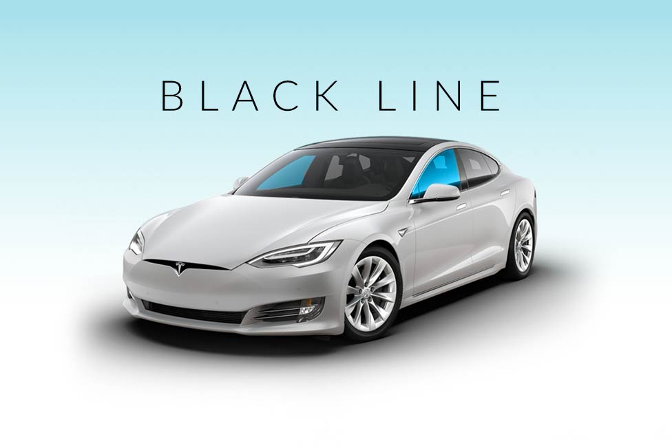 A white tesla model s is sitting on a white surface.
