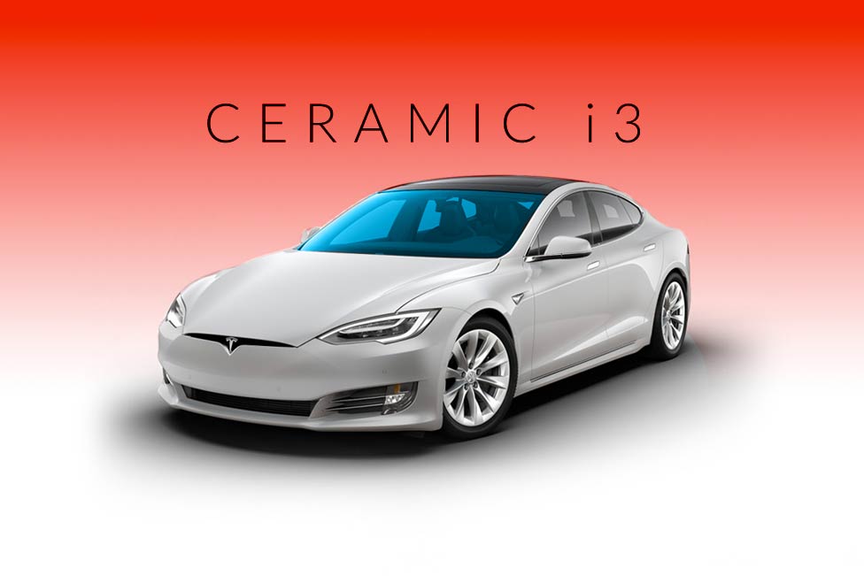 A white tesla model s is sitting on a red background.