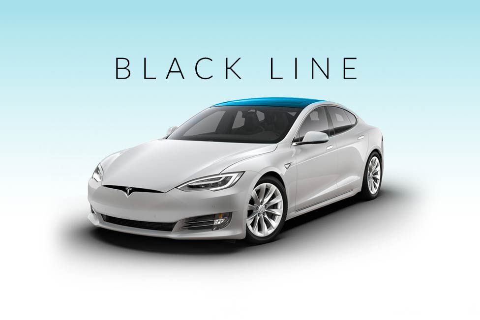 A white tesla model s with a black line roof
