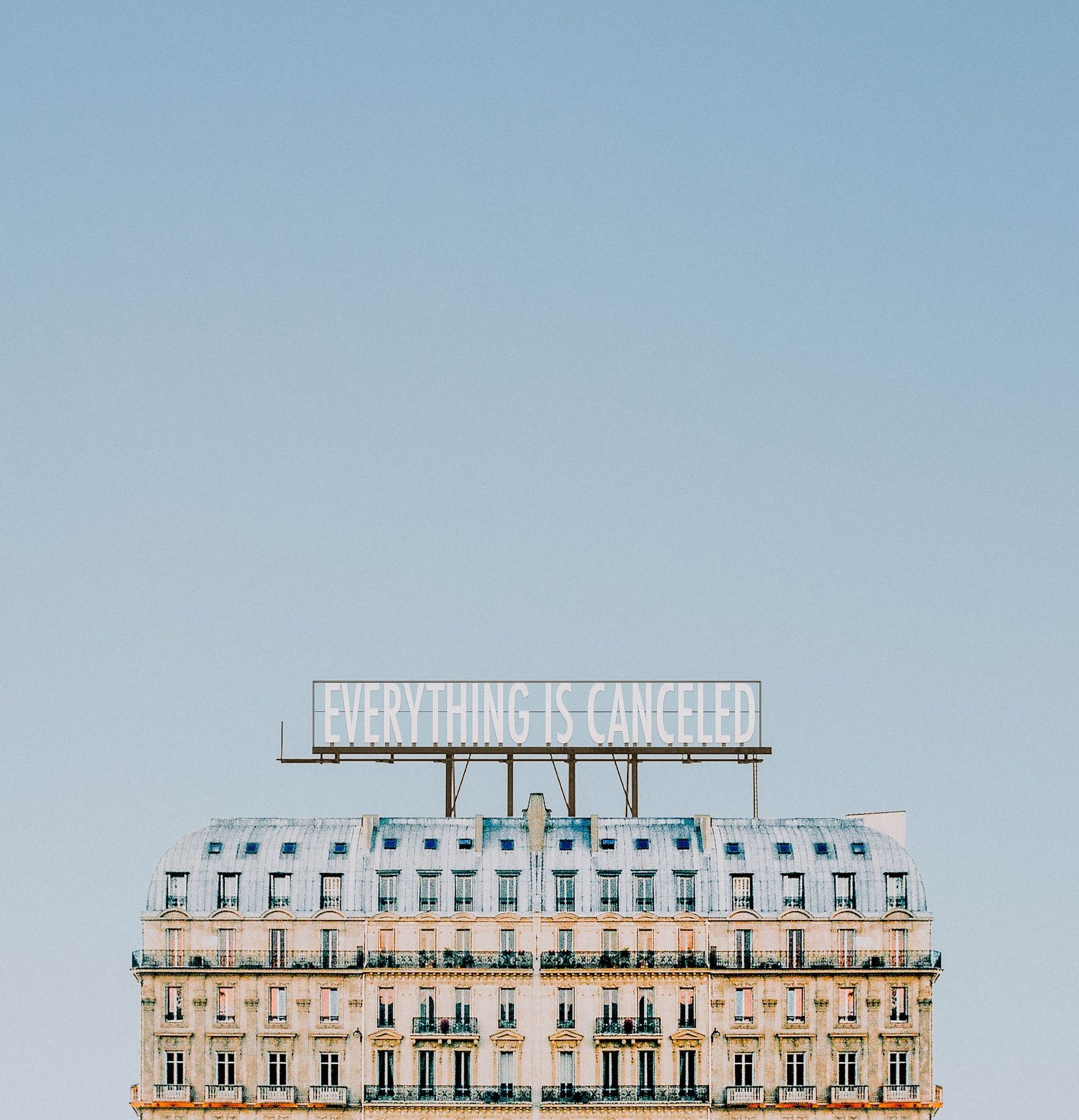 A large building with a sign on top that says `` everything is canceled ''.