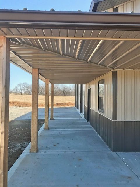 A building with a covered walkway leading to it
