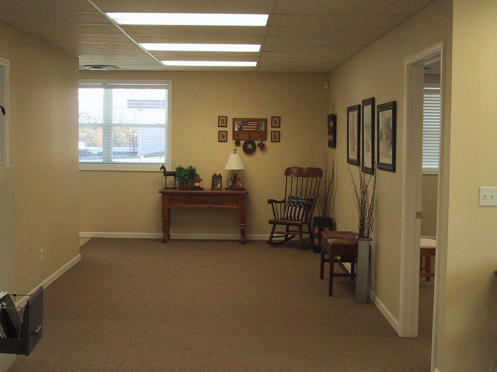 A room with a table and chairs in it