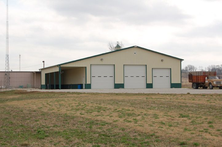 A large building with a truck parked in front of it