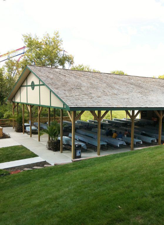 A pavilion with a lot of benches underneath it
