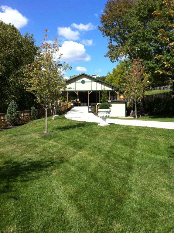 A house with a large lawn in front of it
