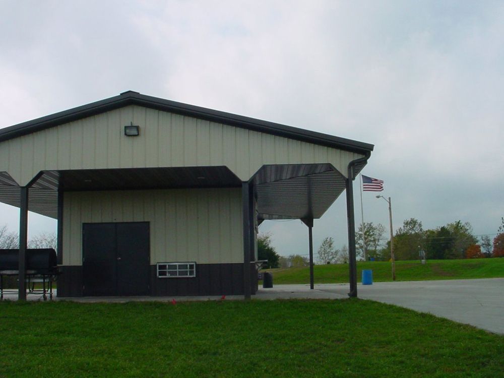 A white and black building with a covered porch