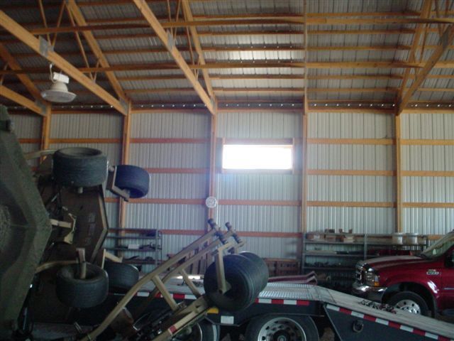 A truck is being towed inside of a building
