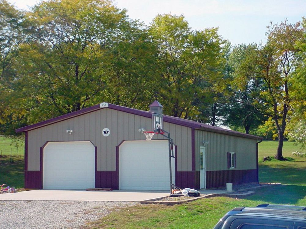 A garage with a basketball hoop in front of it