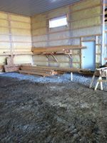 A room with a lot of dirt on the floor and a window.